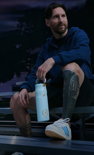 Lionel Messi Sitting On Bleachers Holding Blue Stanley IceFlow Water Bottle